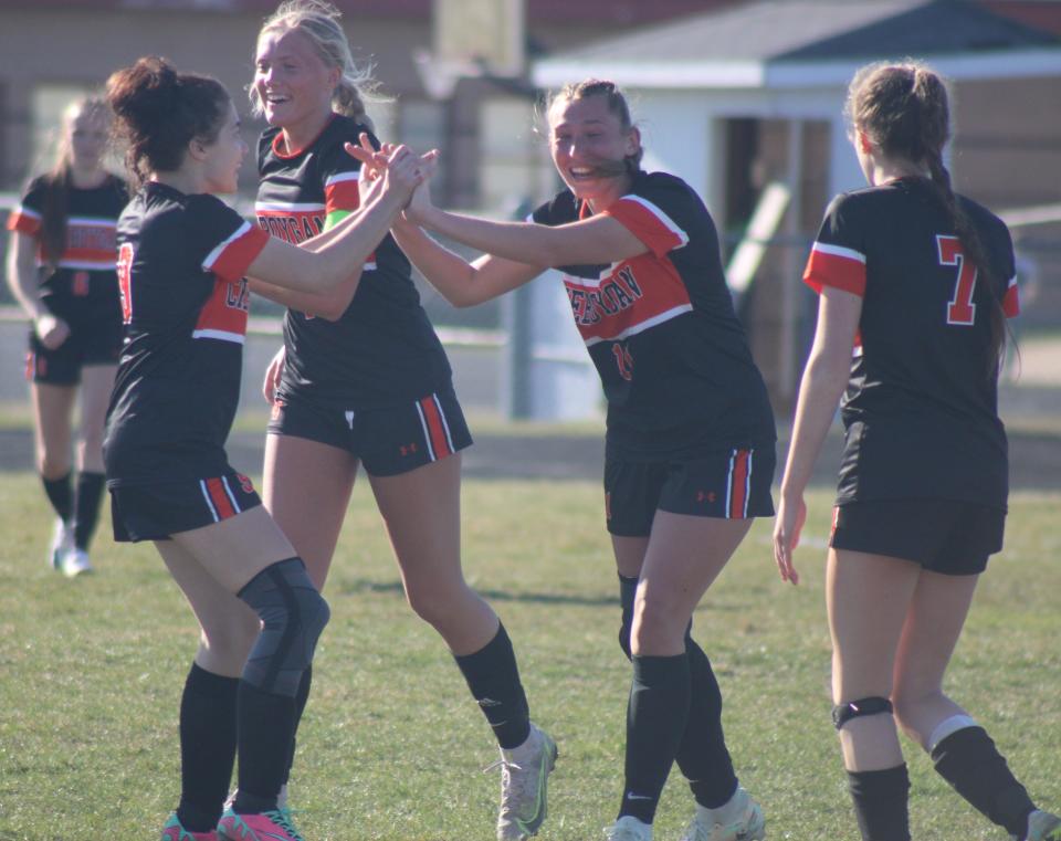 Sophomore Jaelyn Wheelock celebrates with Cheboygan teammates after scoring a long-distance goal right before halftime during Monday's home win over Roscommon.