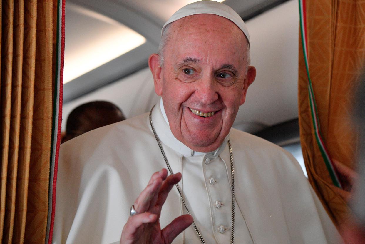 Pope Francis speaks with journalists on board an Alitalia aircraft enroute from Bratislava back to Rome, Wednesday, 15 September 2021 after a four-day pilgrimage to Hungary and Slovakia  (AP)