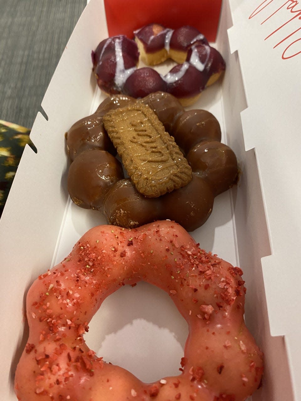 From top, ube, caramel and strawberry mochi doughnuts from Mochinut.