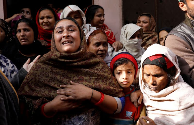 FILE PHOTO: Shaheen, sister of Mohammed Mohsin, who died during clashes with police following protests against a new citizenship law, cries outside their house in Meerut