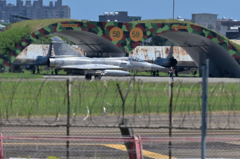 A fully armed ROCAF Mirage 2000-5 taxis on a runway in front of a hangar at Hsinchu Air Base in Hsinchu on August 5, 2022. <em>Photo by SAM YEH/AFP via Getty Images</em>