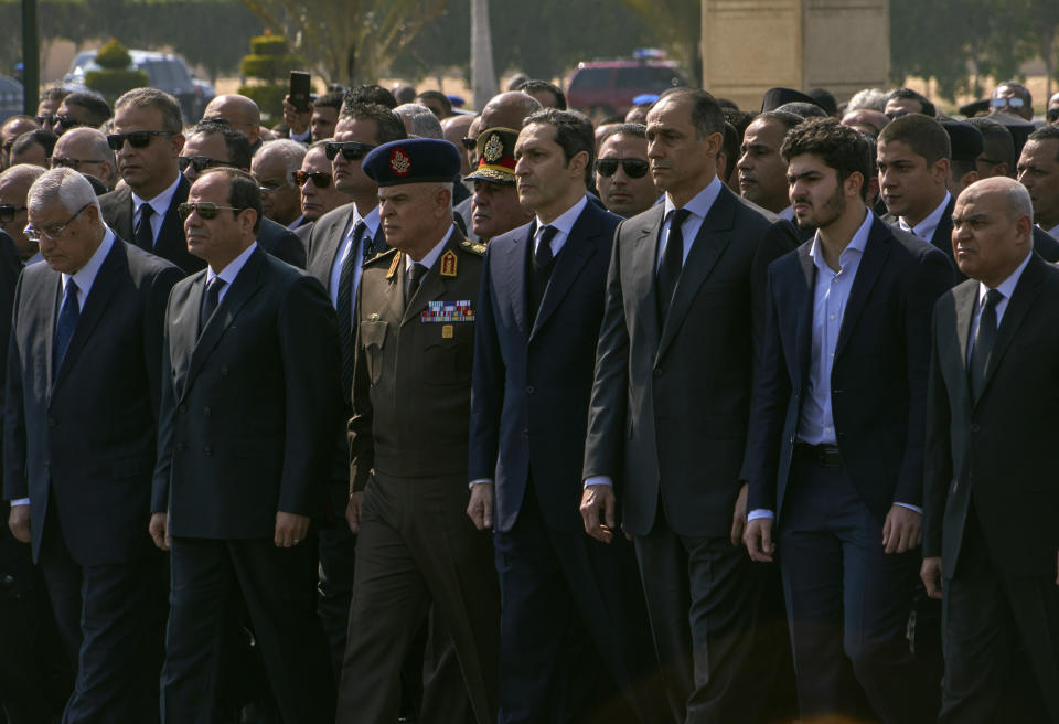 ADDS NAME OF GRANDSON OF THE FORMER PRESIDENT AS OMAR ALAA MUBARAK -- Dignitaries and family members attend the funeral of former President Hosni Mubarak, at Tantawi Mosque, in eastern Cairo, Egypt, Wednesday, Feb. 26, 2020. Egypt is holding a full-honors military funeral for Mubarak who was ousted from power in the 2011 Arab Spring uprising. The 91-year-old Mubarak died on Tuesday at a Cairo military hospital from heart and kidney complications. In front row from left, is former interim President Adly Mansour, current President Abdel Fattah el-Sissi, Military Chief of Staff Mohamed Farid Hegazy, sons of the former president Alaa and Gamal Mubarak, a grandson of the former president Omar Alaa Mubarak, and former Defense Minister Sedki Sobhi. (AP Photo/Hamada Elrasam)