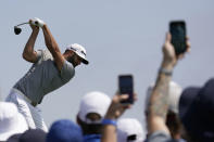 Fans watch as Dustin Johnson plays his shot from the second tee during the first round of the U.S. Open Golf Championship, Thursday, June 17, 2021, at Torrey Pines Golf Course in San Diego. (AP Photo/Gregory Bull)