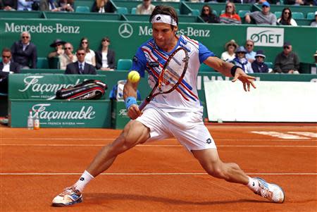 David Ferrer of Spain returns the ball to his compatriot Rafael Nadal during their quarter-final match at the Monte Carlo Masters in Monaco April 18, 2014. REUTERS/Eric Gaillard