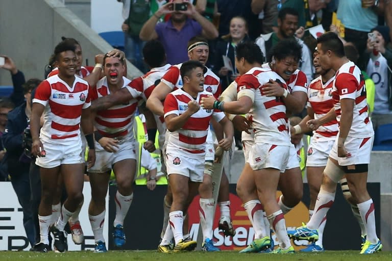 Japan's players celebrate their 2015 Rugby World Cup pool match victory against South Africa, 34-32, in Brighton, south-east England