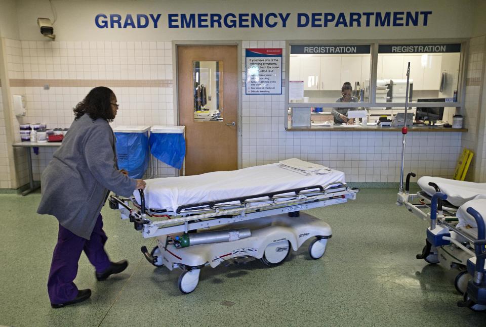 In this Friday, Jan. 24, 2014 photo, a worker wheels beds through the emergency department at Grady Memorial Hospital, in Atlanta. In two years, federal payments to hospitals treating a large share of the nation’s poor will begin to evaporate under the premise that more people than ever will have some form of insurance under the federal health care law. The problem is that many states have refused to expand Medicaid, leaving public safety net hospitals there in a potentially precarious financial situation and elected officials facing growing pressure to find a fiscal fix. And in an election year, Democrats are using the decision by Republican governors not to expand Medicaid as a major campaign issue and arguing the hospital situation could have been avoided. (AP Photo/David Goldman)