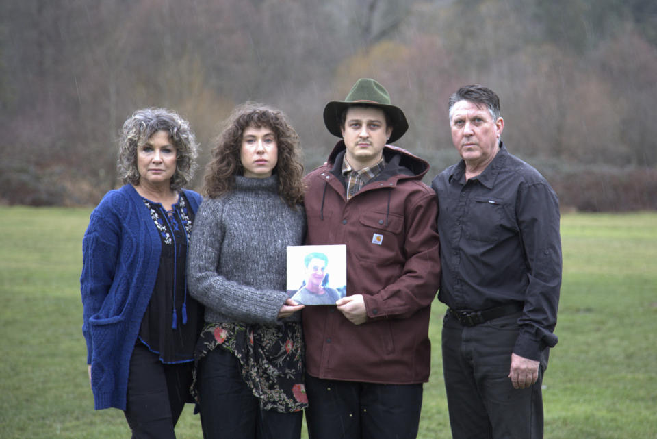 In this undated image provided by Haylee Wendling, family members of Colin Conner pose for a photo as they hold an image of Colin. Conner, who struggled with opioid addiction for years, lost his life to a fentanyl overdose in June 2023, just days after being released from a Salt Lake City jail. Conner's father said the jail had discontinued his methadone prescription, causing him to go through agonizing withdrawal and prompting cravings to return while he was behind bars. (Haylee Wendling via AP)