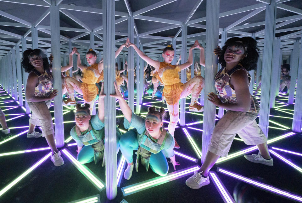 <p>(left to right) Sophie Douglas, Caitlin Anderson and Emmanuella Damptey, who play aliens from the planet Hanyana in the Edinburgh Fringe show WeCameToDance, explore the mirror maze at Camera Obscura & World of Illusions, Edinburgh. Picture date: Thursday August 26, 2021.</p>
