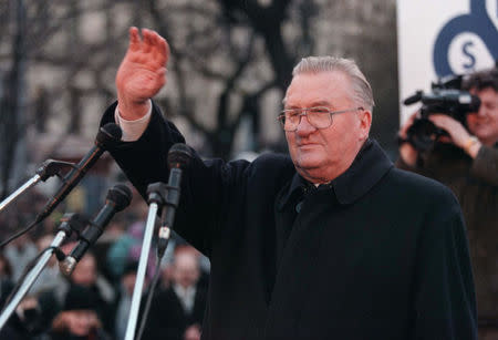 Former Slovak President Michal Kovac waves to anti-government demonstrators protesting against the policies of Slovak Prime Minister Vladimir Meciar in Bratislava in this March 25, 1998 file photo. REUTERS/File Photo