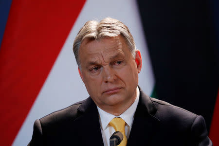 Hungarian Prime Minister Viktor Orban speaks during a press conference in Budapest, Hungary, April 10, 2018. REUTERS/Bernadett Szabo