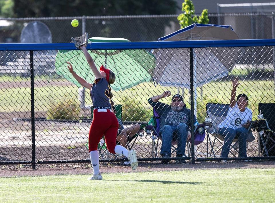 Oakdale’s Briley Everett is unable to catch a fly ball off the bat of Central Catholic’s Jazzelyn Rios in the seventh inning of the Sac-Joaquin Section Division III semifinal game at Central Catholic High School in Modesto, Calif., Tuesday, May 23, 2023. The Rios hit drove in the winning run giving Central a 1-0 victory.