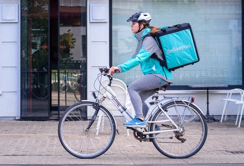 <span class="caption">Deliveroo is one of several rapid delivery companies that have gained popularity during the COVID-19 pandemic.</span> <span class="attribution"><a class="link " href="https://www.shutterstock.com/image-photo/ghent-belgium-may-1-2018-female-1081343123" rel="nofollow noopener" target="_blank" data-ylk="slk:Thomas Dekiere/Shutterstock;elm:context_link;itc:0;sec:content-canvas">Thomas Dekiere/Shutterstock</a></span>