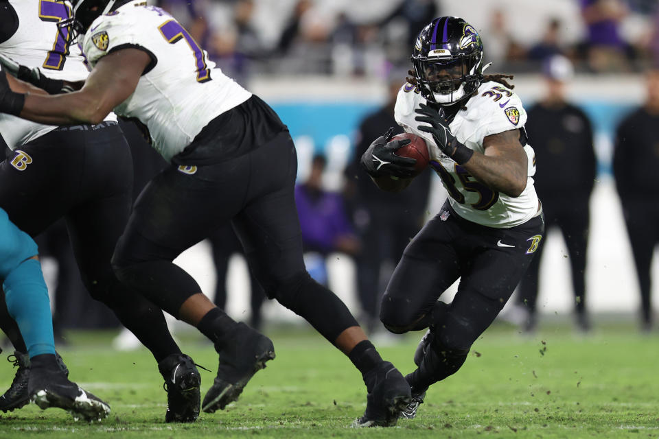 JACKSONVILLE, FLORIDA – DECEMBER 17: Gus Edwards #35 of the Baltimore Ravens runs with the ball against the <a class="link " href="https://sports.yahoo.com/nfl/teams/jacksonville/" data-i13n="sec:content-canvas;subsec:anchor_text;elm:context_link" data-ylk="slk:Jacksonville Jaguars;sec:content-canvas;subsec:anchor_text;elm:context_link;itc:0">Jacksonville Jaguars</a> during the fourth quarter at EverBank Stadium on December 17, 2023 in Jacksonville, Florida. (Photo by Mike Carlson/Getty Images)