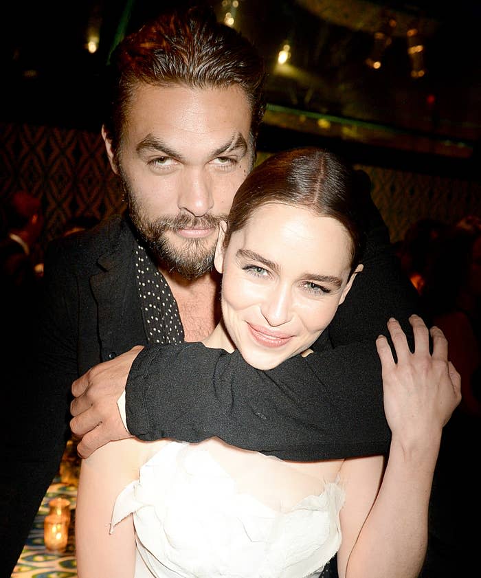 Jason hugs Emilia from behind at a party