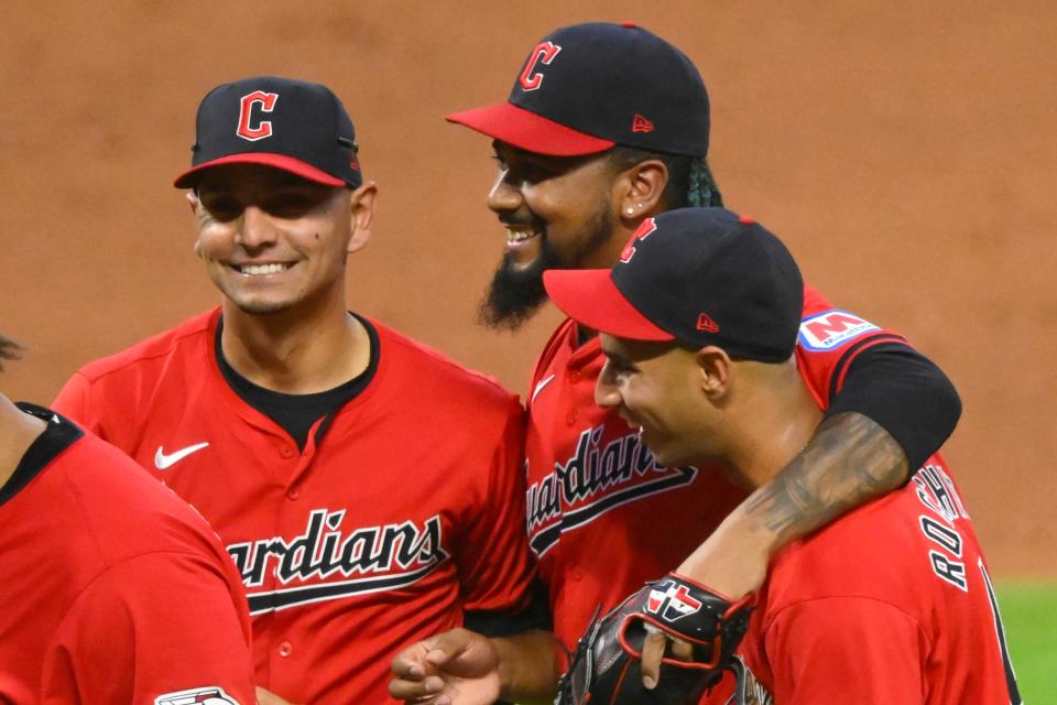 Cleveland Guardians second baseman Andres Gimenez (0), relief pitcher Emmanuel Clase (48) and shortstop Brayan Rocchio (4) celebrate a win over the New York Mets on Monday at Progressive Field.