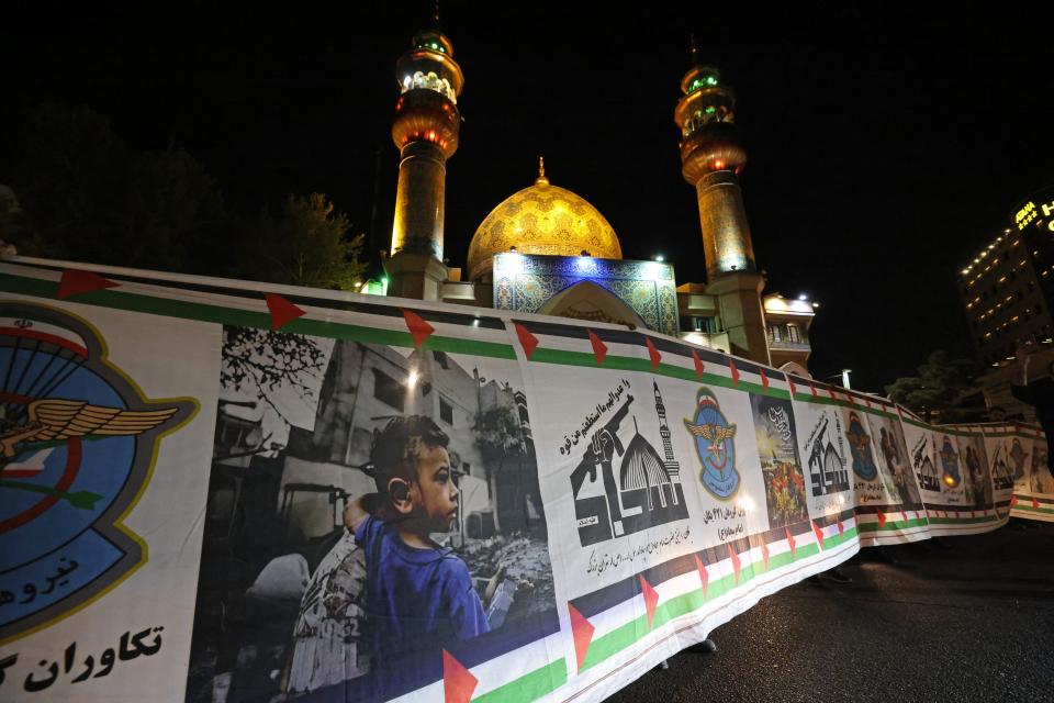 Demonstrators gather at Palestine Square in Tehran on 14 April 2024, after Iran launched a drone and missile attack on Israel (AFP via Getty Images)