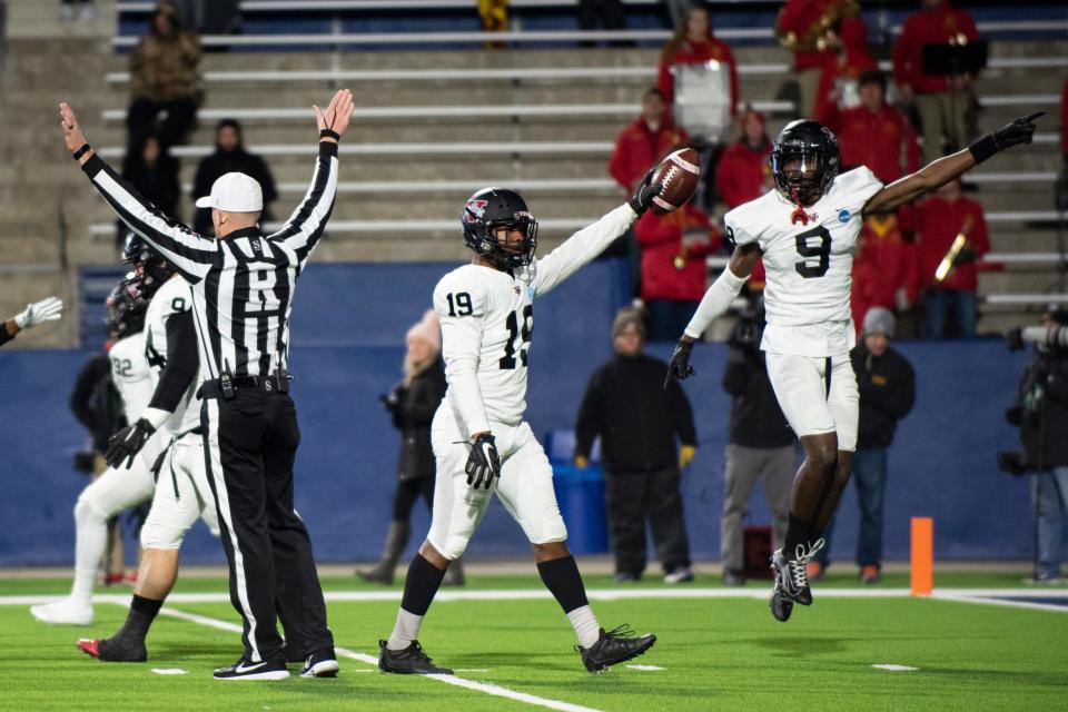 From left, Valdosta State defensive back Cory Roberts (19) and defensive back Christian Matthew (9) point in the opposite direction after recovering a fumble in the first half of the Division II championship NCAA college football game against Ferris State in McKinney, Texas, Saturday, Dec. 18, 2021.