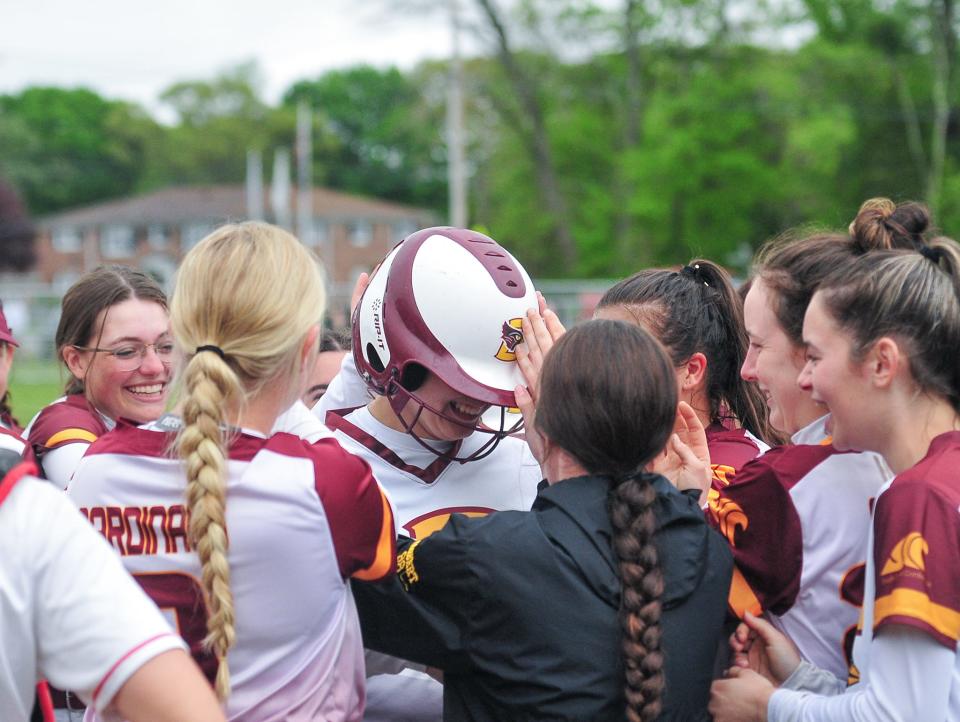 Case’s Brooke Perron is congratulated by teammates after hitting her second home run during Thursday’s game against New Bedford.