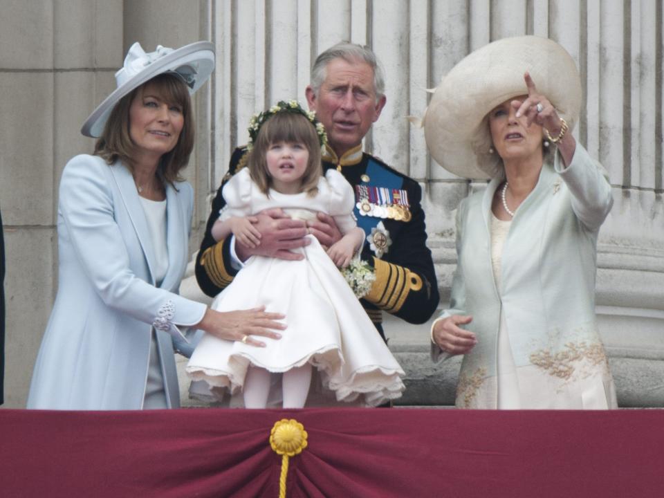 Prince Charles and Camilla on the balcony of Buckingham Palace with Camilla's granddaughter