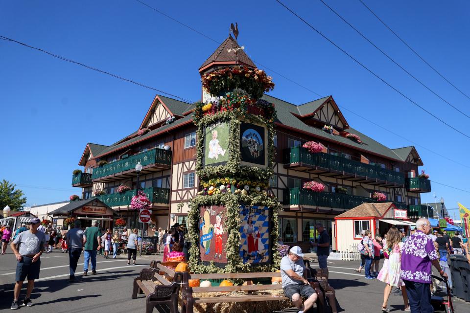 People wander the streets near the Glockenspiel during Mt. Angel's Oktoberfest on Thursday, Sept. 14, 2023 in Mt. Angel, Ore.