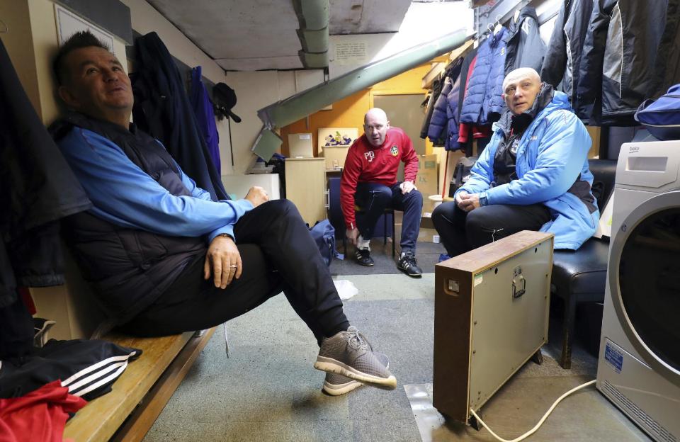 Sutton United manager Paul Doswell, left, ahead of a training session at Gander Green Lane, London, Thursday Feb. 16, 2017. Sutton United, the fifth-tier semiprofessional team will play Arsenal, the 13-time English champions, after reaching the fifth round of the FA Cup competition for the first time in its 118-year history on Monday Feb. 20. (Andrew Matthews/PA via AP)