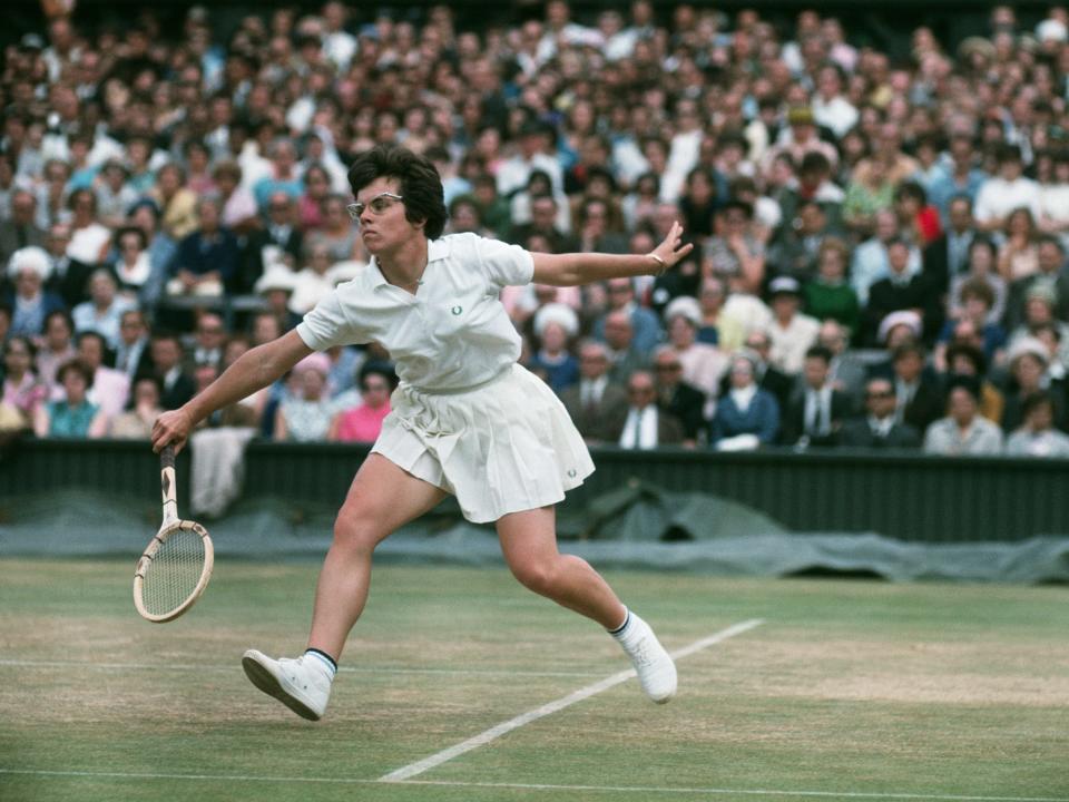 Billie Jean King runs during a match at the 1965 Wimbledon Championship.
