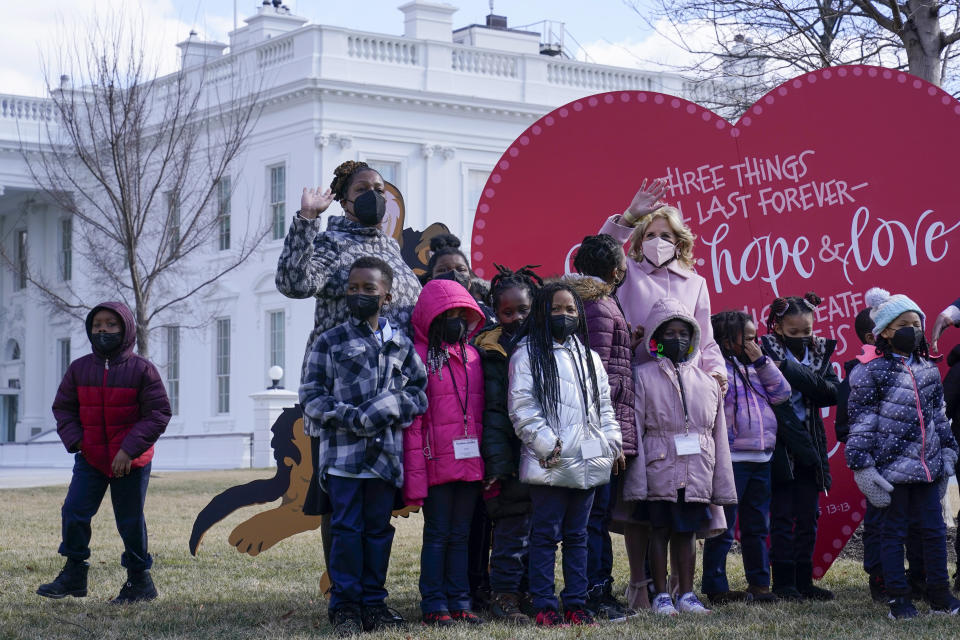 First lady Jill Biden poses for a photo with Aiton Elementary School students and staff as she welcomes school children to the White House in Washington, Monday, Feb. 14, 2022, to celebrate Valentine's Day. (AP Photo/Susan Walsh)