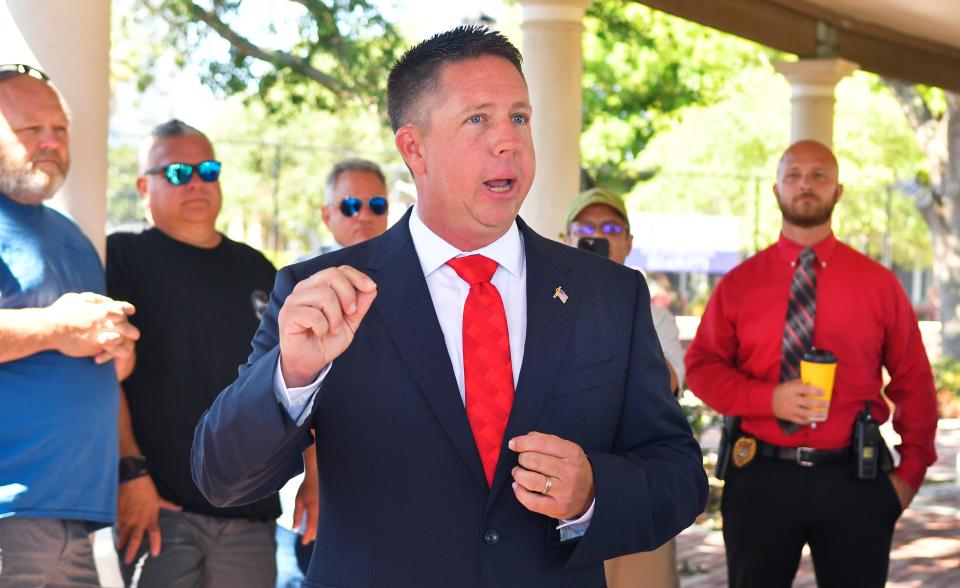 Chris Hattaway, a Cocoa police officer and candidate for County Commission District 2, said Sheriff Wayne Ivey  offered to help get him a job if he dropped out of the race. Here, Hattaway announces his commission run at Cocoa's Riverfront Park in May 2022.