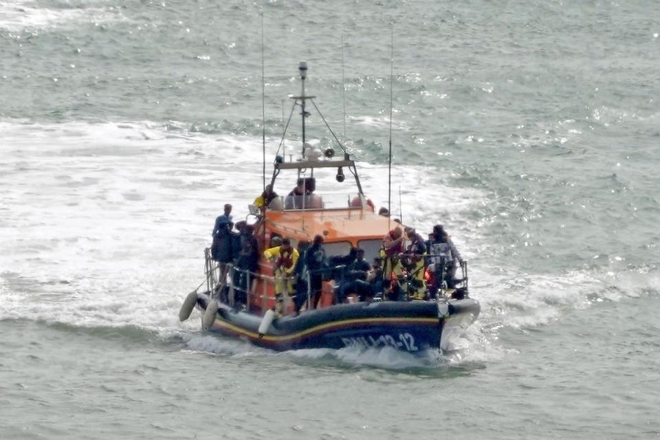 A group of people believed to be migrants are taken to Dover, Kent (PA Wire)