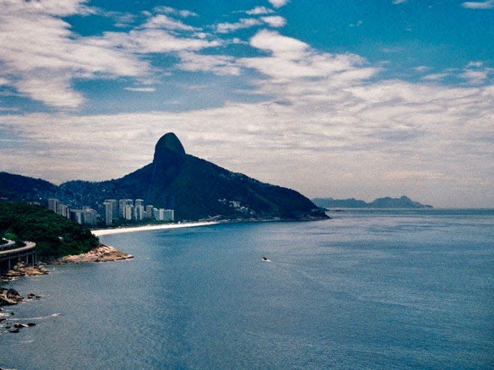 An infinity pool with a view of the ocean and mountain in Rio de Janeiro Brazil