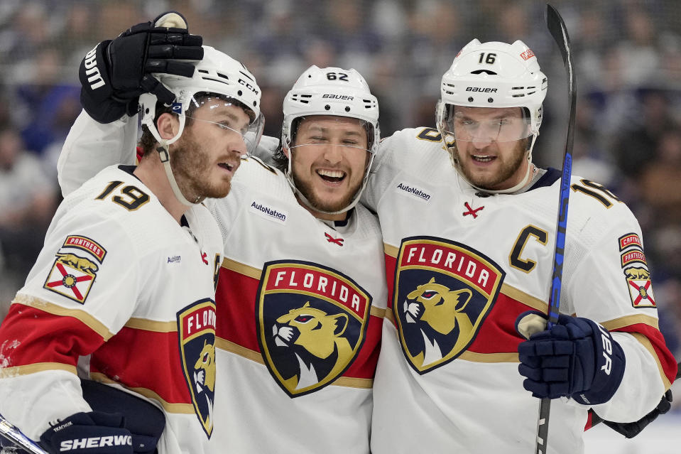 Florida Panthers defenseman Brandon Montour (62) celebrates his goal with teammates Matthew Tkachuk (19) and Aleksander Barkov (16) during the third period of Game 1 of an NHL hockey Stanley Cup second-round playoff series against the Toronto Maple Leafs in Toronto, Tuesday, May 2, 2023. (Frank Gunn/The Canadian Press via AP)