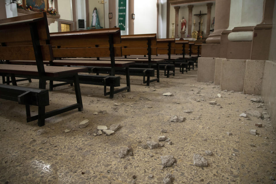 Debris covers the floor of a church the day after an earthquake in Coalcoman, Michoacan state, Mexico, Tuesday, Sept. 20, 2022. A magnitude 7.6 earthquake shook Mexico’s central Pacific coast on Monday, killing at least one person. (AP Photo/Armando Solis)