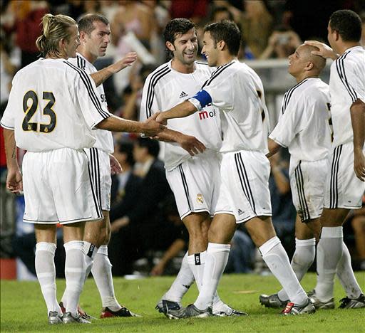 Real Madrid players (L to R) David Beckham, Zinedine Zidane, Luis Figo, Raul Gonzalez, Roberto Carlos and Ronaldo congratulate each other after scoring against a Hong Kong Select side at Hong Kong Stadium, 08 August 2003. Real Madrid are in Hong Kong on the third leg of a four-nation Asian tour. Real won the match 4-2 AFP PHOTO/RICHARD A BROOKS