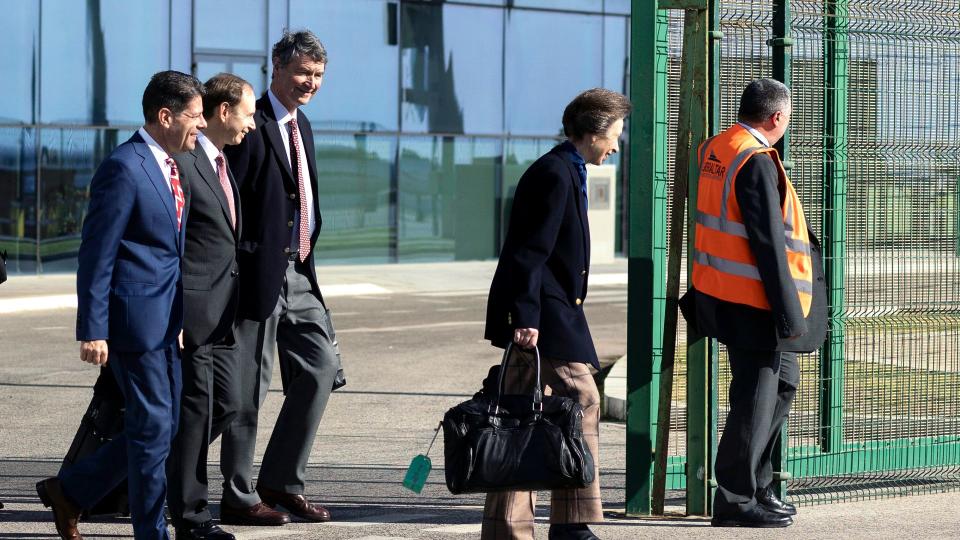 Princess Anne on runway holding bag