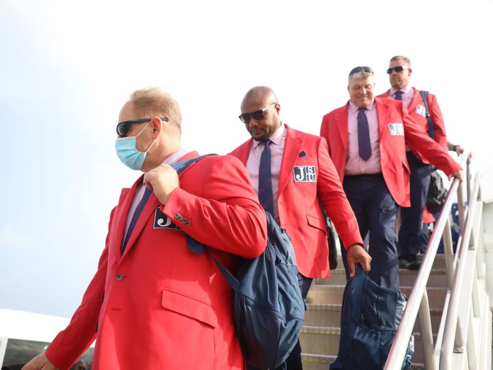 JSU coaches exit their flight to Miami.