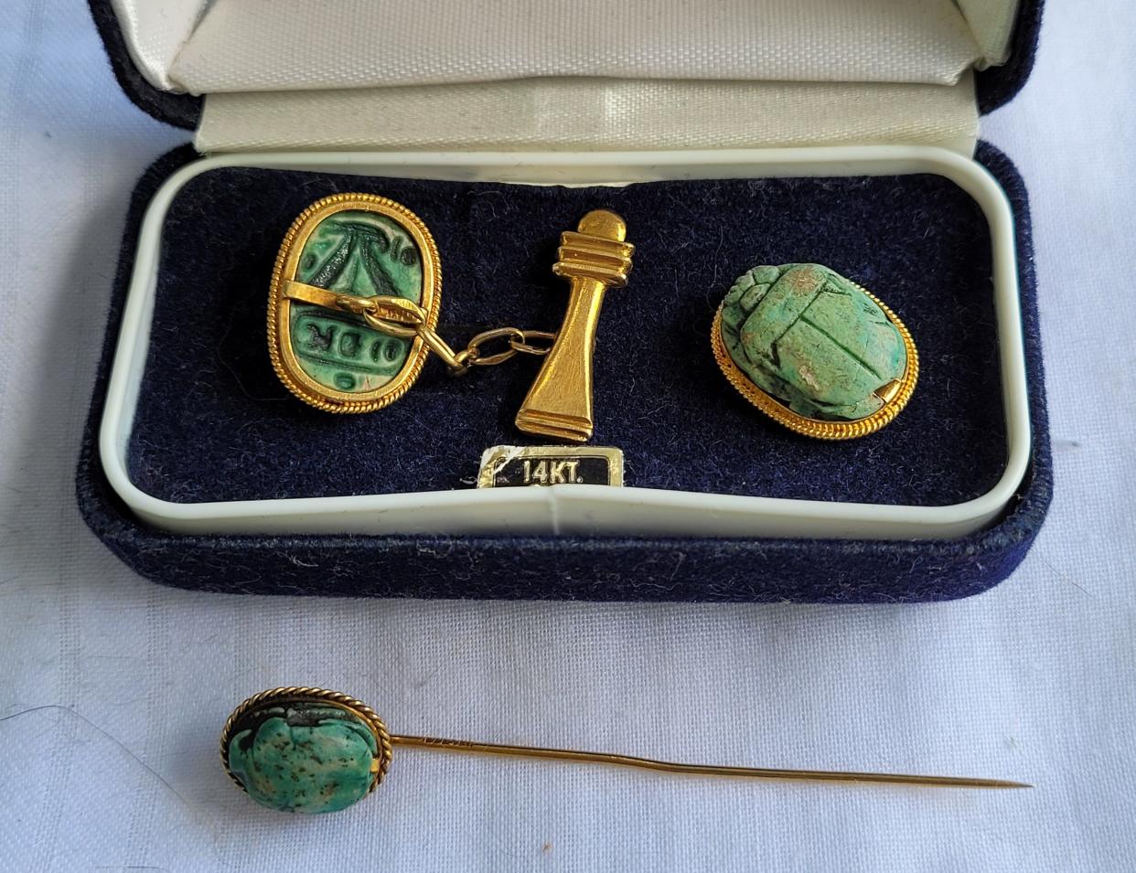 These scarab cufflinks and tie tack appear to be of a high-quality standard.