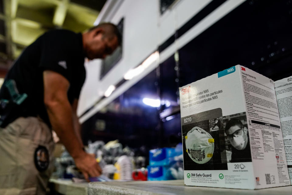 LAPD personnel assemble personal safety kits for field officers to protect themselves from exposure to the novel coronavirus March 11, 2020 in Los Angeles. | Kent Nishimura—Los Angeles Times/Getty Images