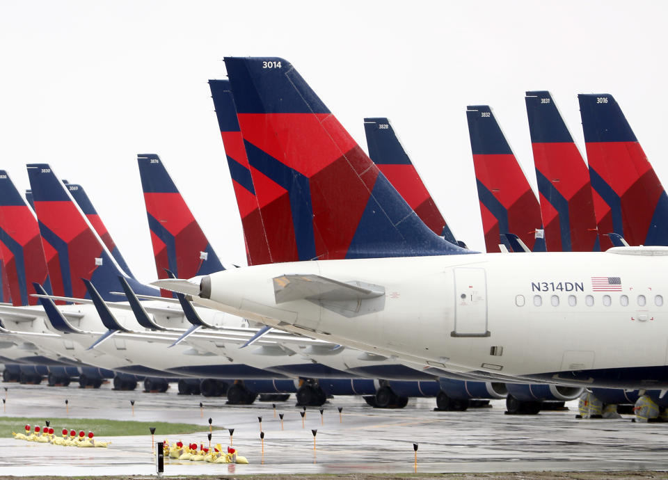 KANSAS CITY, MISSOURI - APRIL 03:  Planes belonging to Delta Air Lines sit idle at Kansas City International Airport on April 03, 2020 in Kansas City, Missouri. U.S. carriers reported an enormous drop in bookings amid the spread of the coronavirus and are waiting for a government bailout to fight the impact. Delta lost almost $2 billion in March and parked half of its fleet in order to save money. (Photo by Jamie Squire/Getty Images)