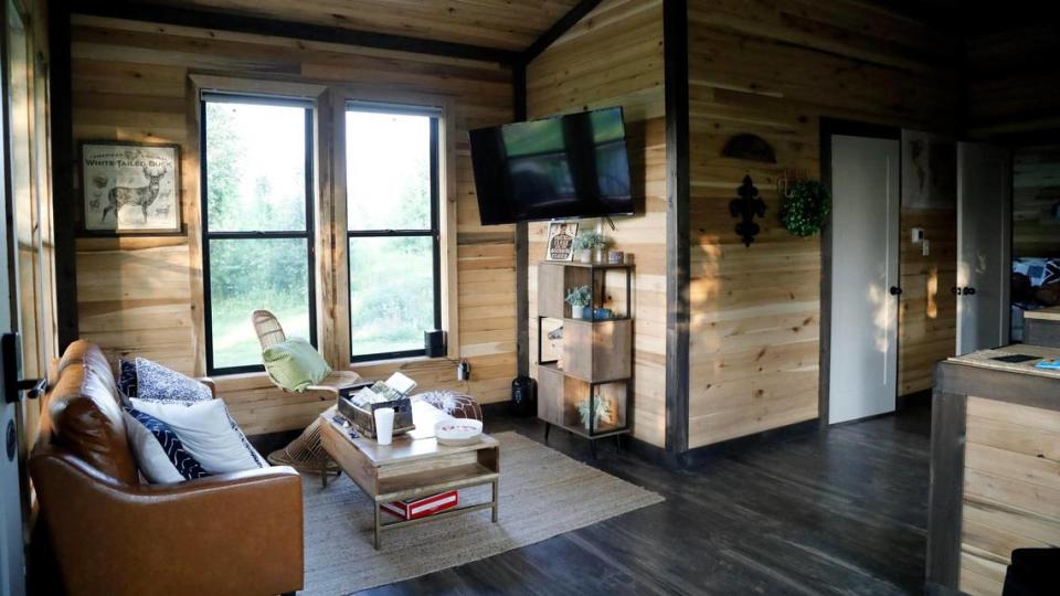 The seating area of Cabin Three on Tuesday, July 25, 2023 at Bourbon Barrel Cottages in Lawrenceburg, Ky.