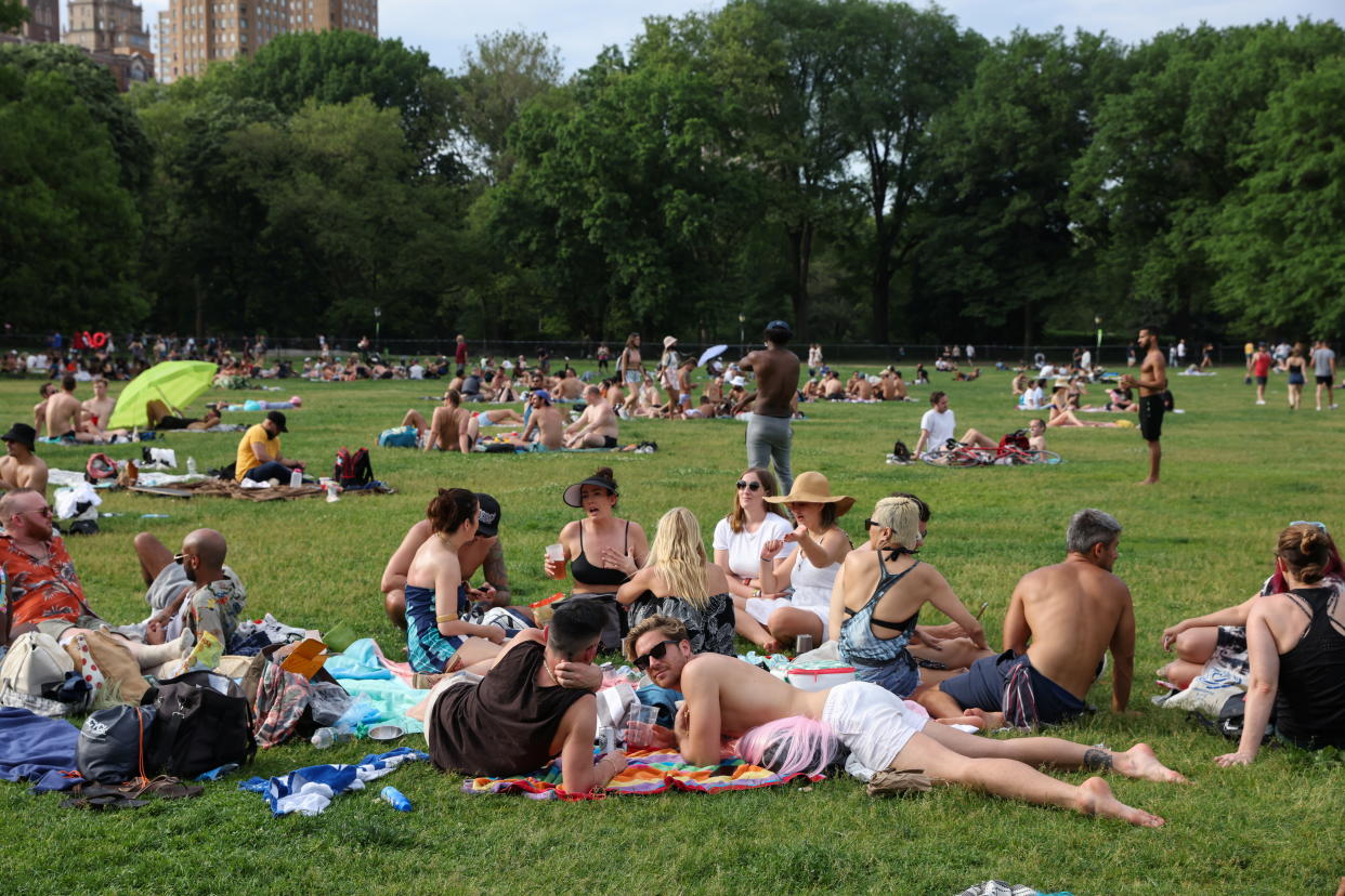 People enjoy socializing without masks in Central Park in the Manhattan borough of New York City, on May 23, 2021. (Caitlin Ochs/Reuters)