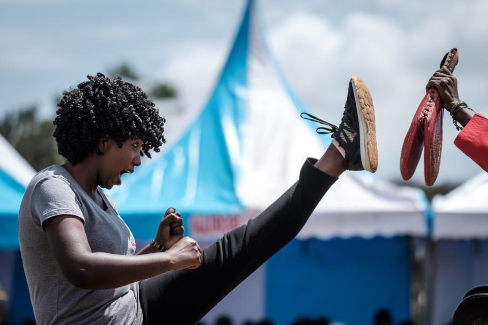 <p>A woman performs taekwondo during the ceremony of the International Women’s Day at Kawangware in Nairobi on March 8, 2018. (Photo: Yasuyoshi Chiba/AFP/Getty Images) </p>