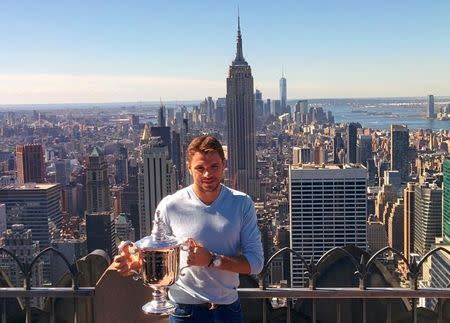 Stan Wawrinka of Switzerland, winner of the 2016 U.S. Open tennis tournament poses with the trophy in Manhattan, New York, U.S., September 12, 2016. REUTERS/Tony Pyle