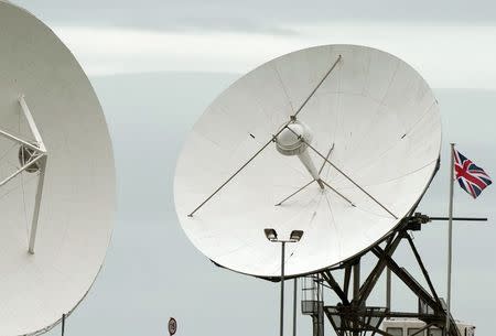 Satellite dishes are seen at GCHQ's outpost at Bude, close to where trans-Atlantic fibre-optic cables come ashore in Cornwall, southwest England in this file photograph dated June 23, 2013. REUTERS/Kieran Doherty/files