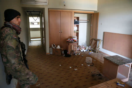 An Iraqi soldier stands in a damaged room in the five-star Ninewah Oberoi Hotel in Mosul city, Mosul, Iraq January 30, 2017. Picture taken January 30, 2107. REUTERS/Ahmed Jadallah