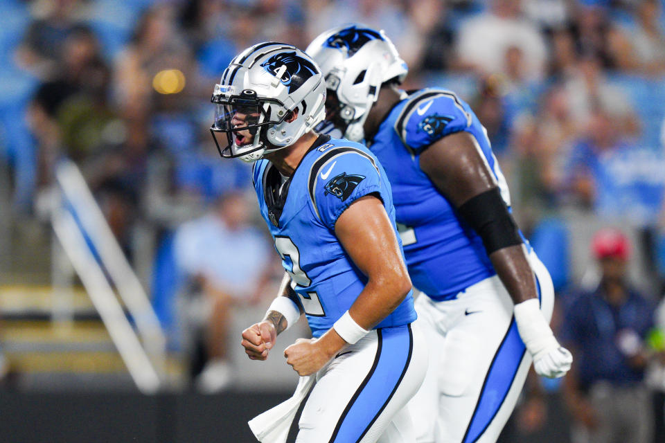 Carolina Panthers quarterback Matt Corral celebrates after a touchdown by running back Spencer Brown during the second half of a preseason NFL football game against the Detroit Lions Friday, Aug. 25, 2023, in Charlotte, N.C. (AP Photo/Jacob Kupferman)