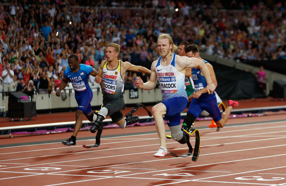 Great Britain's Jonnie Peacock (right) wins the Men's 100m T44 during day three of the 2017 World Para Athletics Championships at London Stadium.