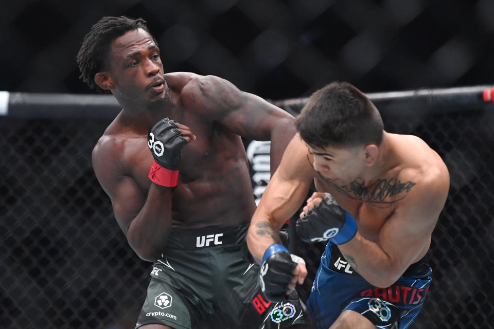 Aug 19, 2023; Boston, MA, USA; Da’mon Blackshear (red gloves) fights Mario Bautista (blue gloves) during UFC 292 at TD Garden. Mandatory Credit: Bob DeChiara-USA TODAY Sports