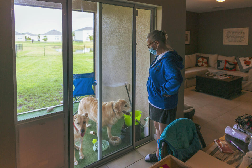 Image: Jennifer Waddleton with her dogs at her home on Sept. 9, 2021 in Lehigh Acres, Fla. (Saul Martinez for NBC News)