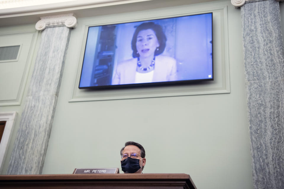 Sen. Gary Peters, D-Mich., questions nominee for Secretary of Commerce, Gina Raimondo, during her Senate Commerce, Science, and Transportation Committee confirmation hearing, Tuesday, Jan. 26, 2021, on Capitol Hill in Washington. (Tom Williams/Pool via AP)