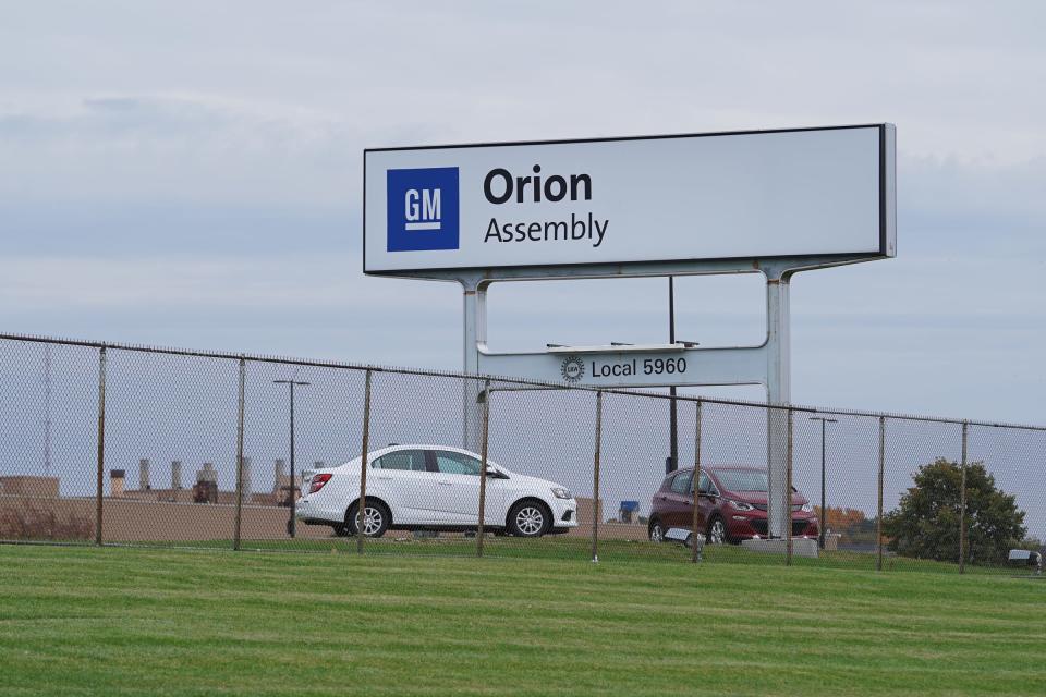 A 48-year-old man is in custody after a fight at GM's Orion Assembly Plant led to a co-worker's death.